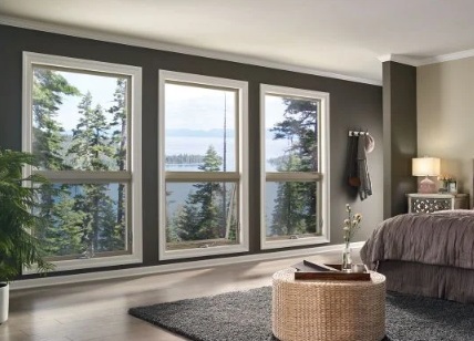 Modern living room with large windows showing natural light and energy efficiency benefits for replacement windows in Laguna Niguel, CA.