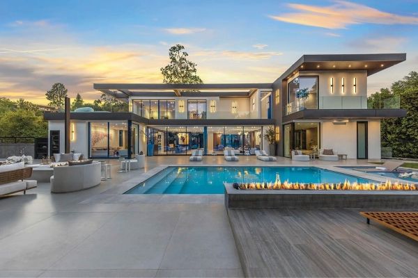 Luxury modern home with expansive floor-to-ceiling glass walls and outdoor living spaces, highlighting premium Laguna Beach, CA replacement windows that enhance coastal views, natural light, and contemporary design.