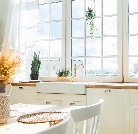 Modern kitchen with wide, energy-efficient grid windows, an example of quality window replacement Sarasota, FL.